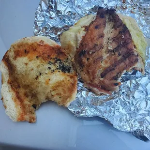 a piece of meat and a piece of bread