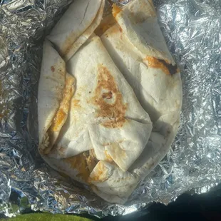 a tortilla wrapped in aluminum foil