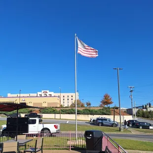 American flag by outside seating.