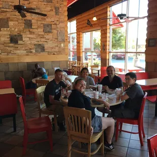 a group of people sitting at a table
