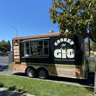 a food truck parked on the side of the road