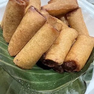 a plate of food on a banana leaf