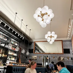 two women sitting at a table in a restaurant