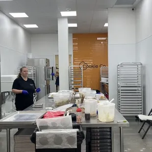  a woman in a kitchen