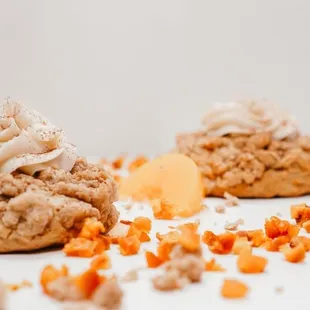 two cookies with frosting on top
