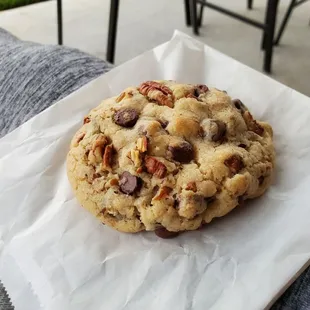a chocolate chip cookie on a napkin