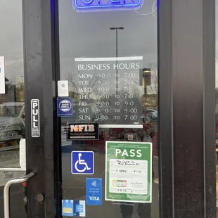 Entry door with Hours of Operation