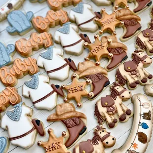 Cowboy Baby shower with adorable cartoon horse; expert level cookie decorating!