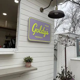 the outside of a restaurant with a sign that says gold's friends