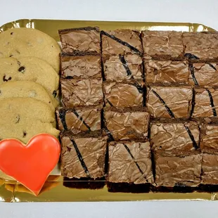 a tray of brownies and cookies