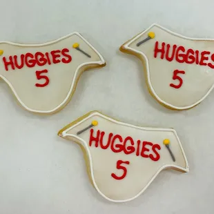 three cookies with the number 5 and huggies 5