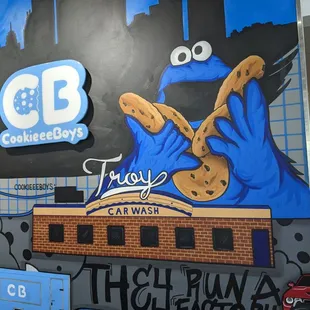 a blue car and a cookie monster