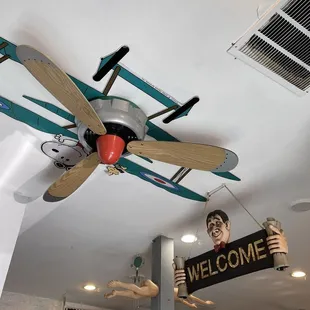 a ceiling fan with a welcome sign