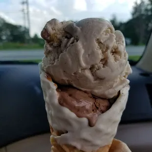 Dipped white chocolate waffle cone with German chocolate cake and pecan something, for the road.