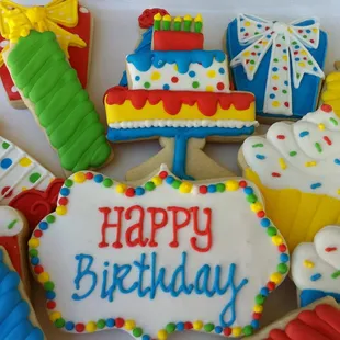 a plate of decorated birthday cookies