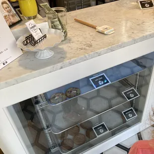 a little girl looking into a display case