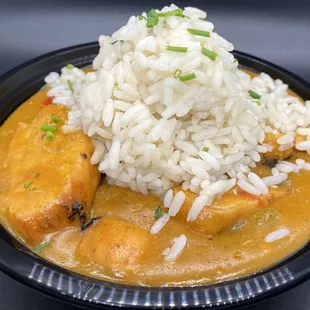 a plate of food with rice and meat