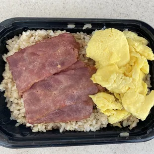 Turkey bacon and scrambled eggs on brown rice