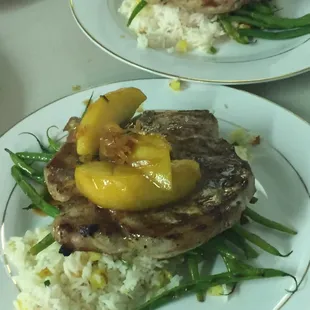 Grilled pork chops with grilled pineapple jasmine rice and French green beans with garlic butter and toasted almonds.