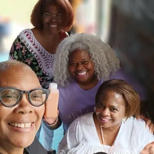 a group of people taking a selfie