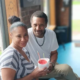 a man and woman sitting at a table
