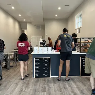 a group of people in a coffee shop