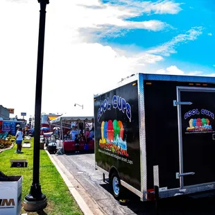 a food truck parked on the side of the road