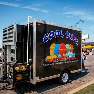 an ice cream truck parked on the side of the road
