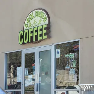 a car parked in front of a coffee shop