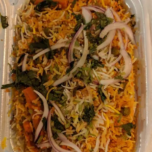 a meal in a styrofoam container