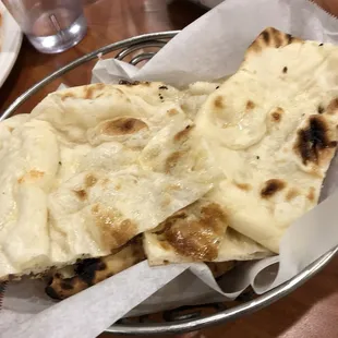 The server brought us cold naan and told us that they made the naan before they made the curry so it turned cold. Thin and probably frozen.