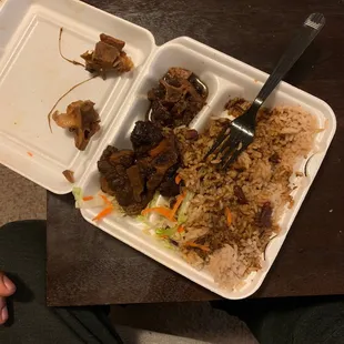 a plate of meat and rice