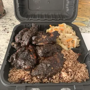 Jerk wingettes entree with rice and peas, cabbage
