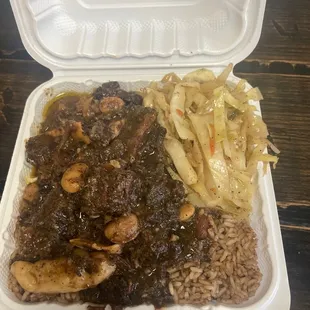 Oxtails, rice and peas and cabbage