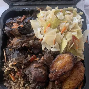 Brown stew chicken with rice &amp; peas, cabbage and plantain.