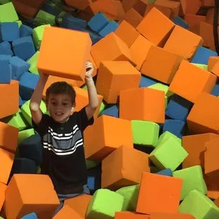 Foam pit and a swing rope.
