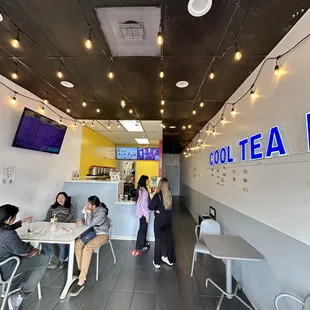 people sitting at tables and eating