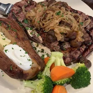 Ribeye, $35.99 comes with two sides. added on mushrooms and onions.