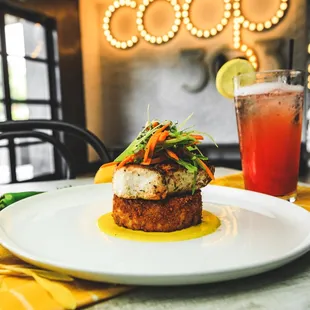 Local Fresh Catch served grilled or blackened, with crimini mushroom rice cake, mustard streaks, snow pea salad, and summer squash bechamel.