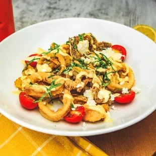 New menu item! Fried Calamari, served with banana peppers, grape tomatoes, feta cheese, fresh basil, and lemon aioli.
