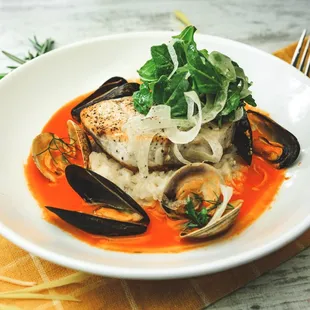 New menu item: Bouillabaise. Comes with pan seared fresh catch, mussels and clams, pecorino risotto, shaved fennel and arugula salad.