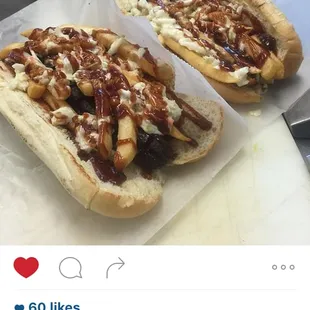 two hot dogs with toppings