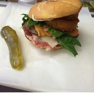 a sandwich and pickle on a table