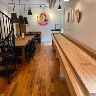 a shuffle table in the center of the room