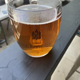 a glass of beer on a table