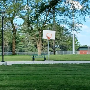 1/2 Basketball court, rim needs a fixin'