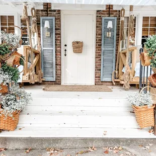 a front porch decorated for fall