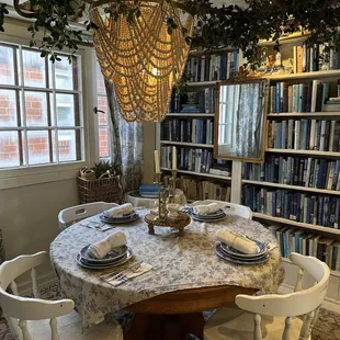 a dining room with a table and chairs
