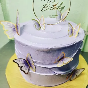 a birthday cake with butterflies