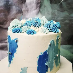 a blue and white cake